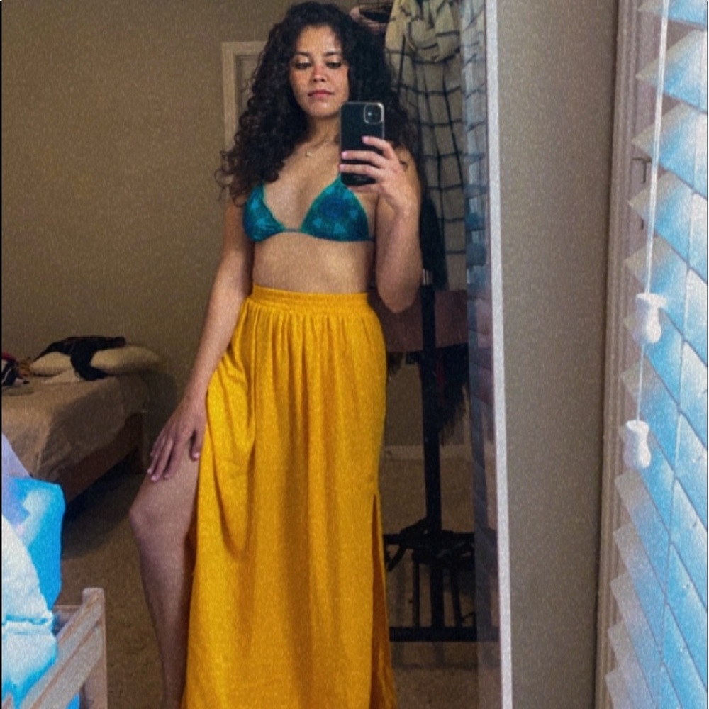 Yellow skirt + green bikini ( Brazilian cut ), very cheeky. Never used